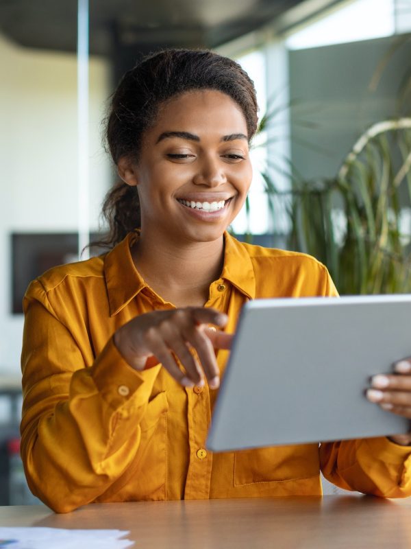 modern-technologies-in-business-happy-black-businesswoman-using-modern-digital-tablet-working.jpg